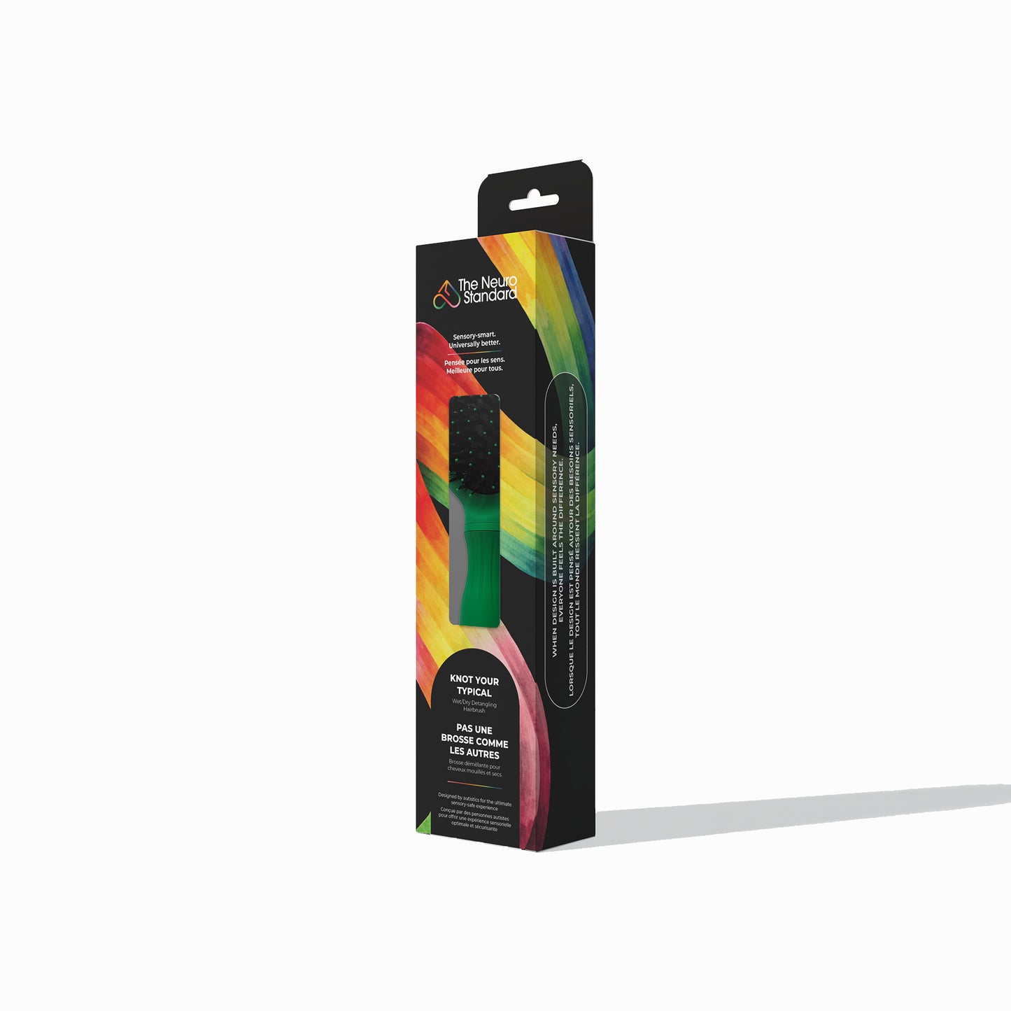 Retail packaging box for The Neuro Standard's sensory-friendly hairbrush, featuring a black box with a vibrant rainbow design.